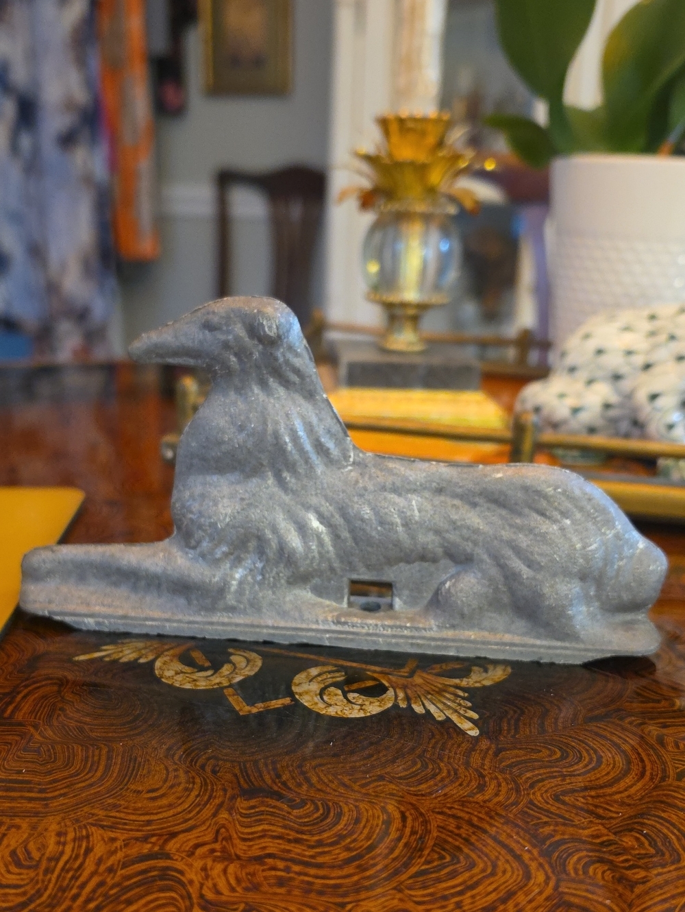 Vintage cast metal dog gate or fence topper, resembling a sighthound.